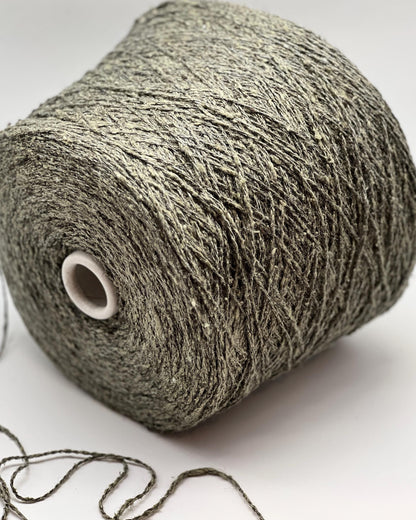 Roll of gray yarn on a white background