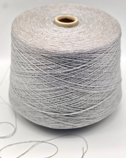 Spool of gray yarn on a white background