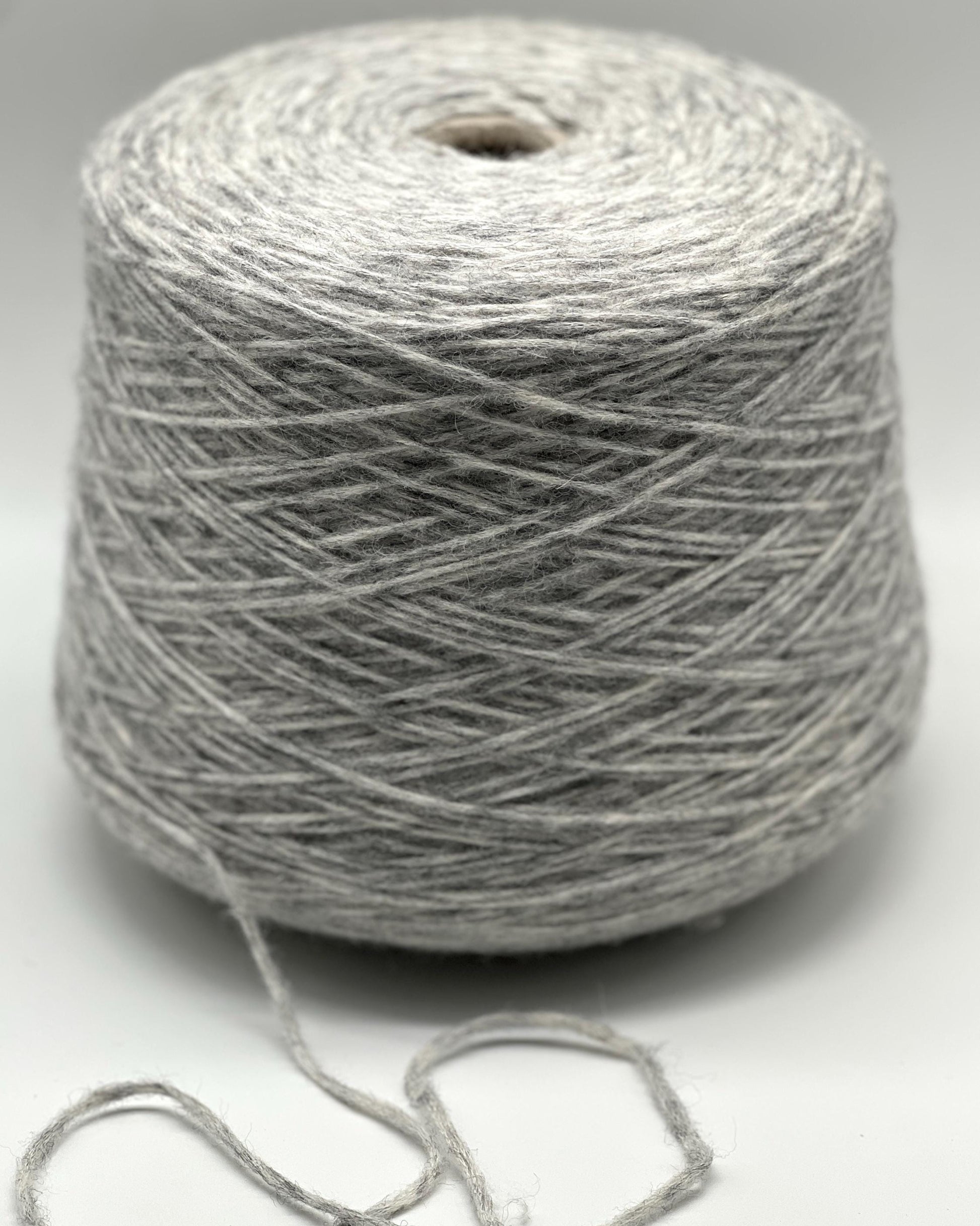 Gray skein of yarn on a white background