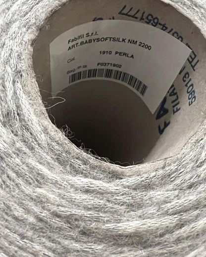 Close-up of a spool of yarn with visible label