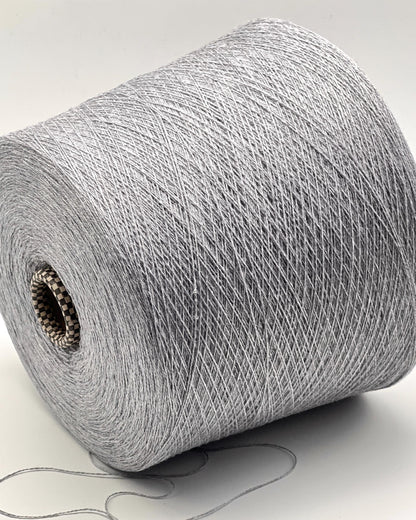 Roll of gray yarn on a white background