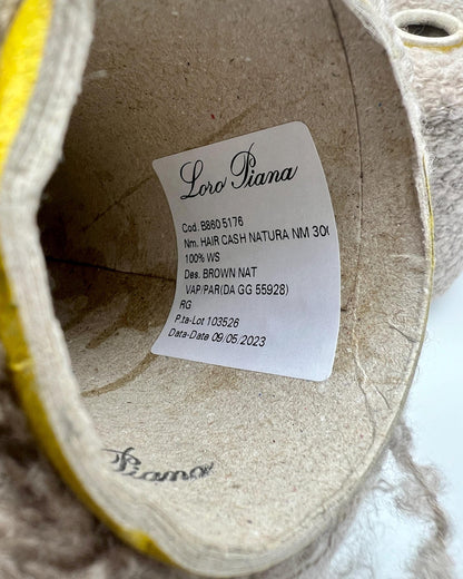 Loro Piana label inside a shoe on a marble surface