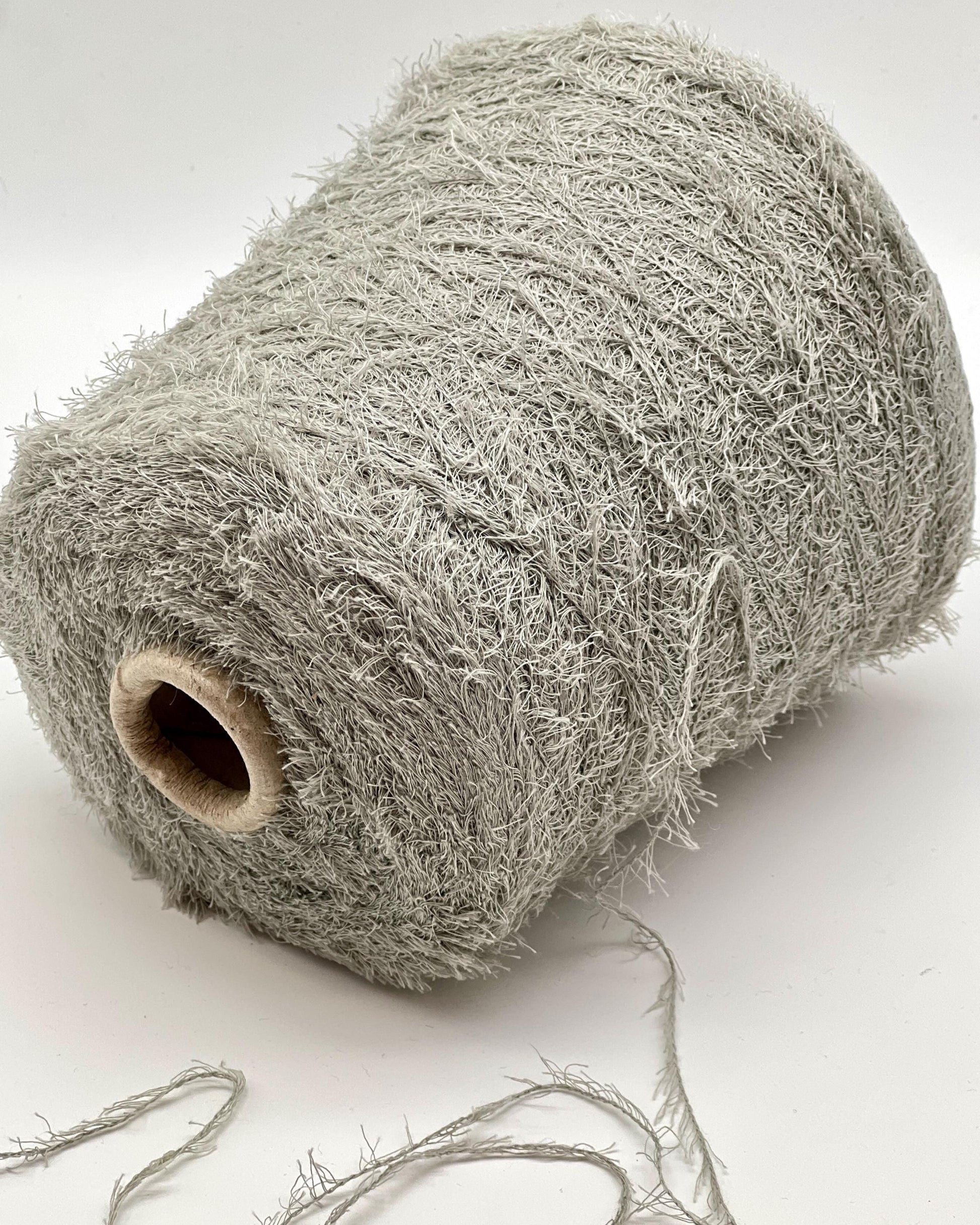 Roll of gray string or twine on a white background