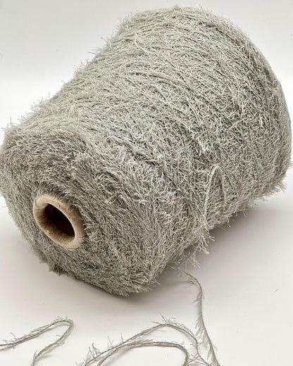 Roll of gray string or twine on a white background