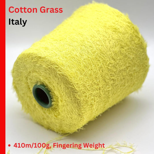 Roll of yellow yarn with text indicating 'Cotton Grass Italy' and product details.