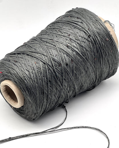 Spool of gray thread on a white background