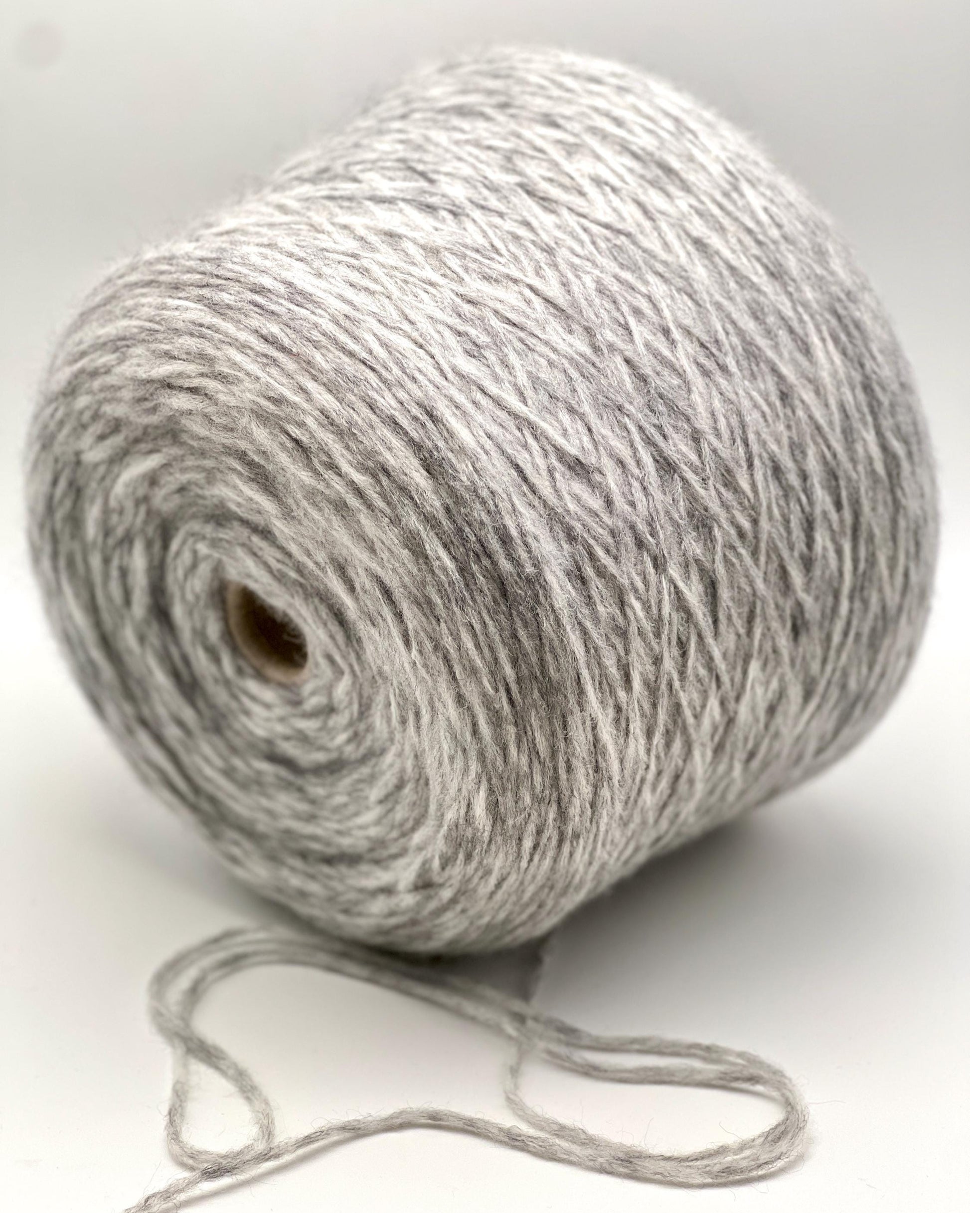 Ball of gray yarn on a white background