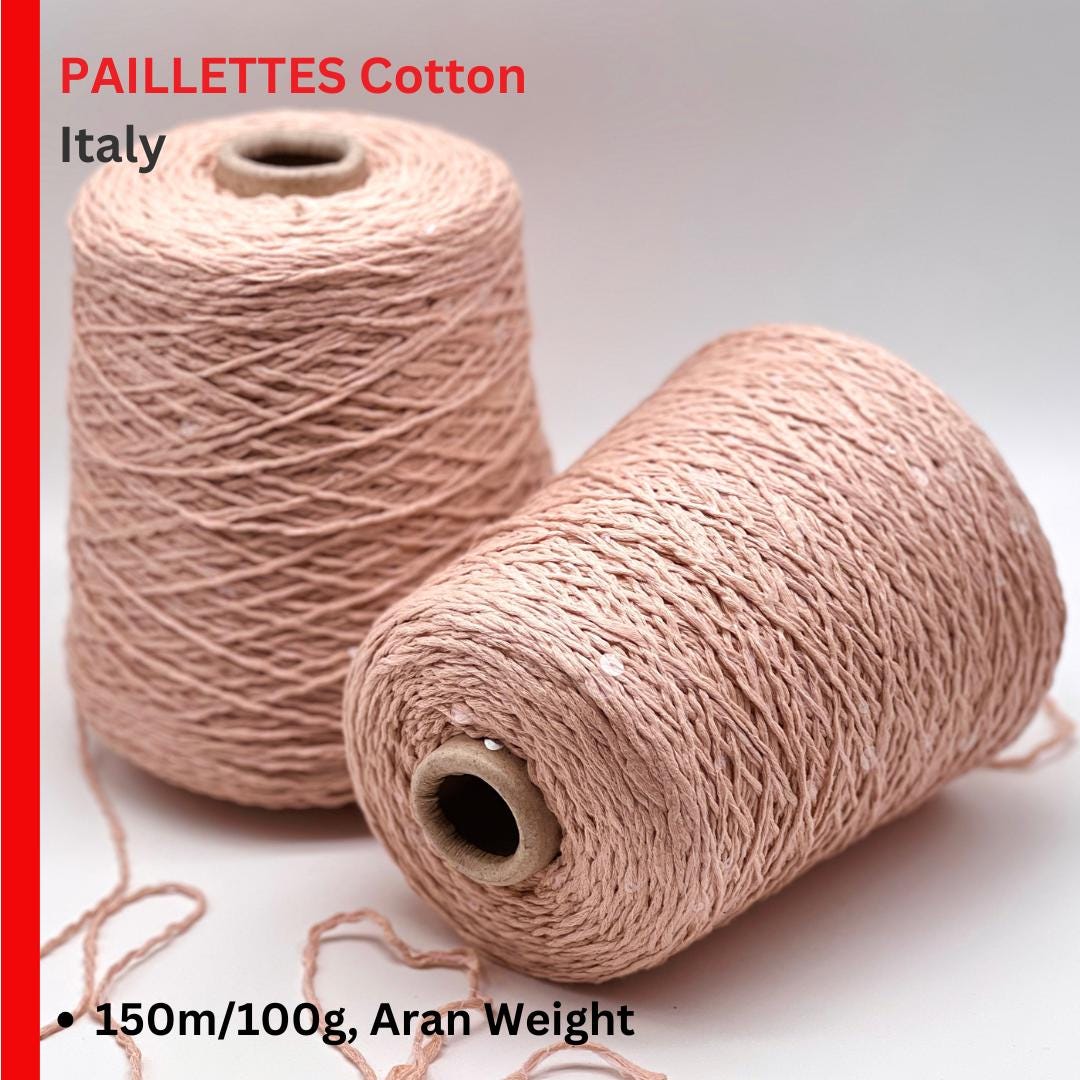 Two spools of Paillettes Cotton from Italy on a white background with text about weight and origin.