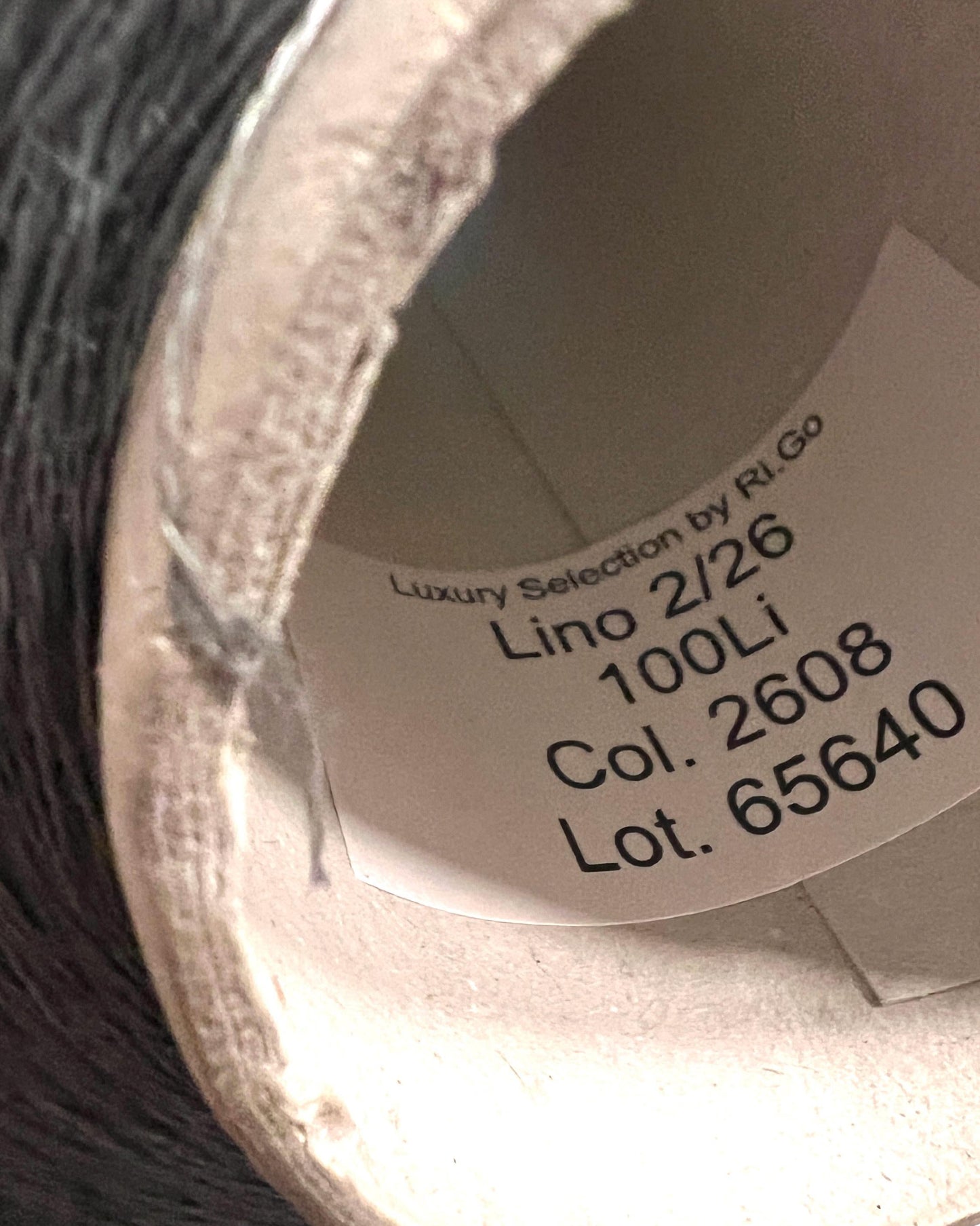 Close-up of a spool of thread with label details