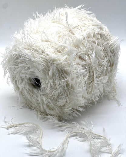 Ball of white yarn on a white background