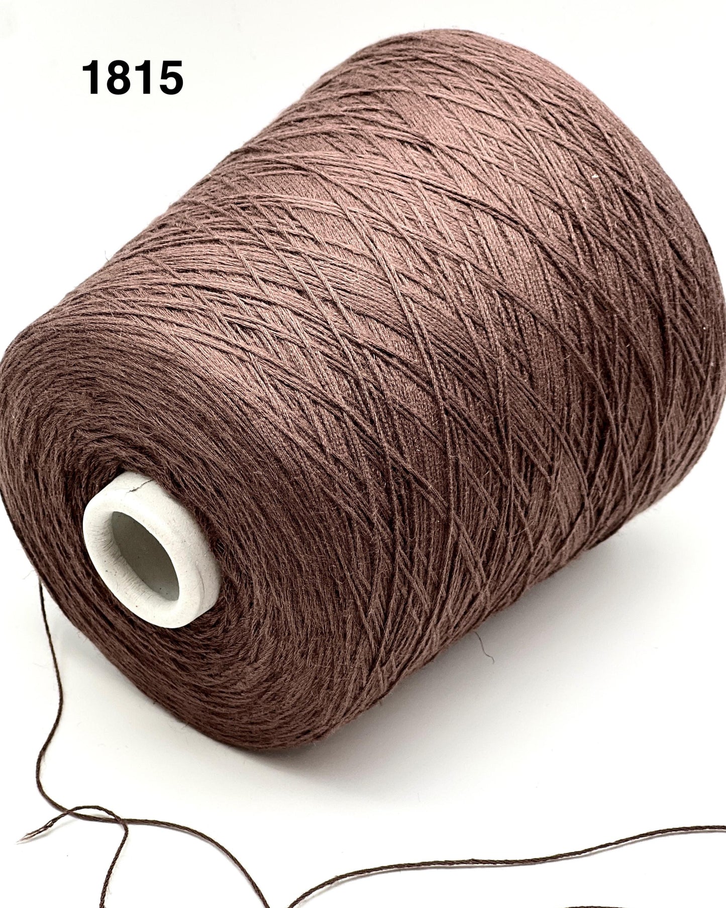 Brown spool of thread on a white background with number 1815.