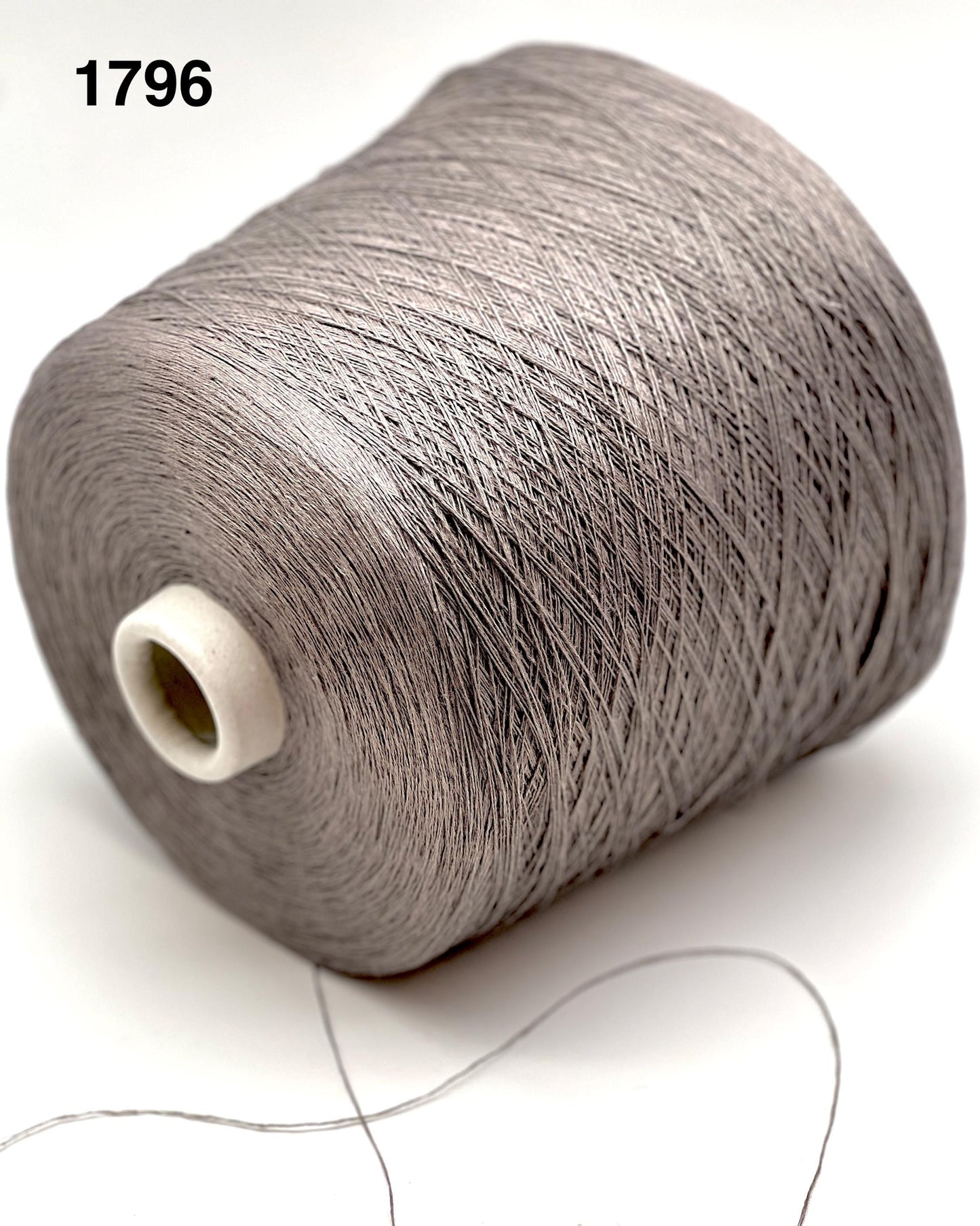 Spool of gray thread on a white background