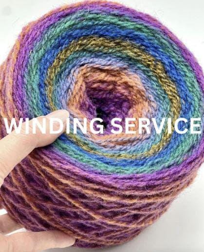 Multicolored yarn ball with 'Winding Service' text overlay
