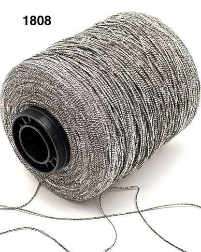 Spool of silver thread on a white background with number 1808.