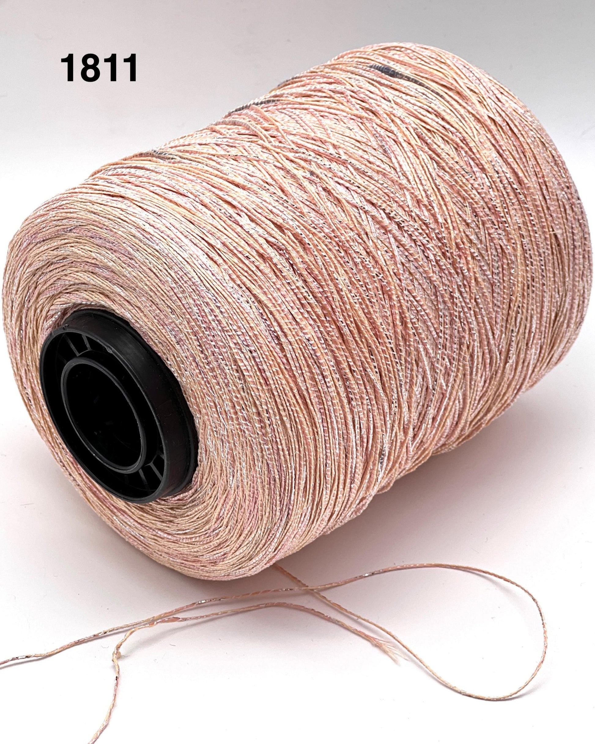Spool of beige thread on a white background with the number 1811.