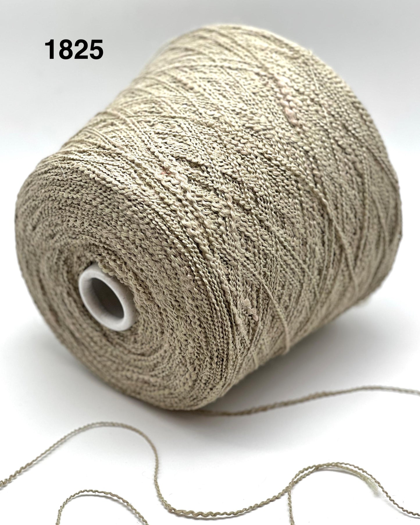 Spool of beige thread on a white background with the number 1825.
