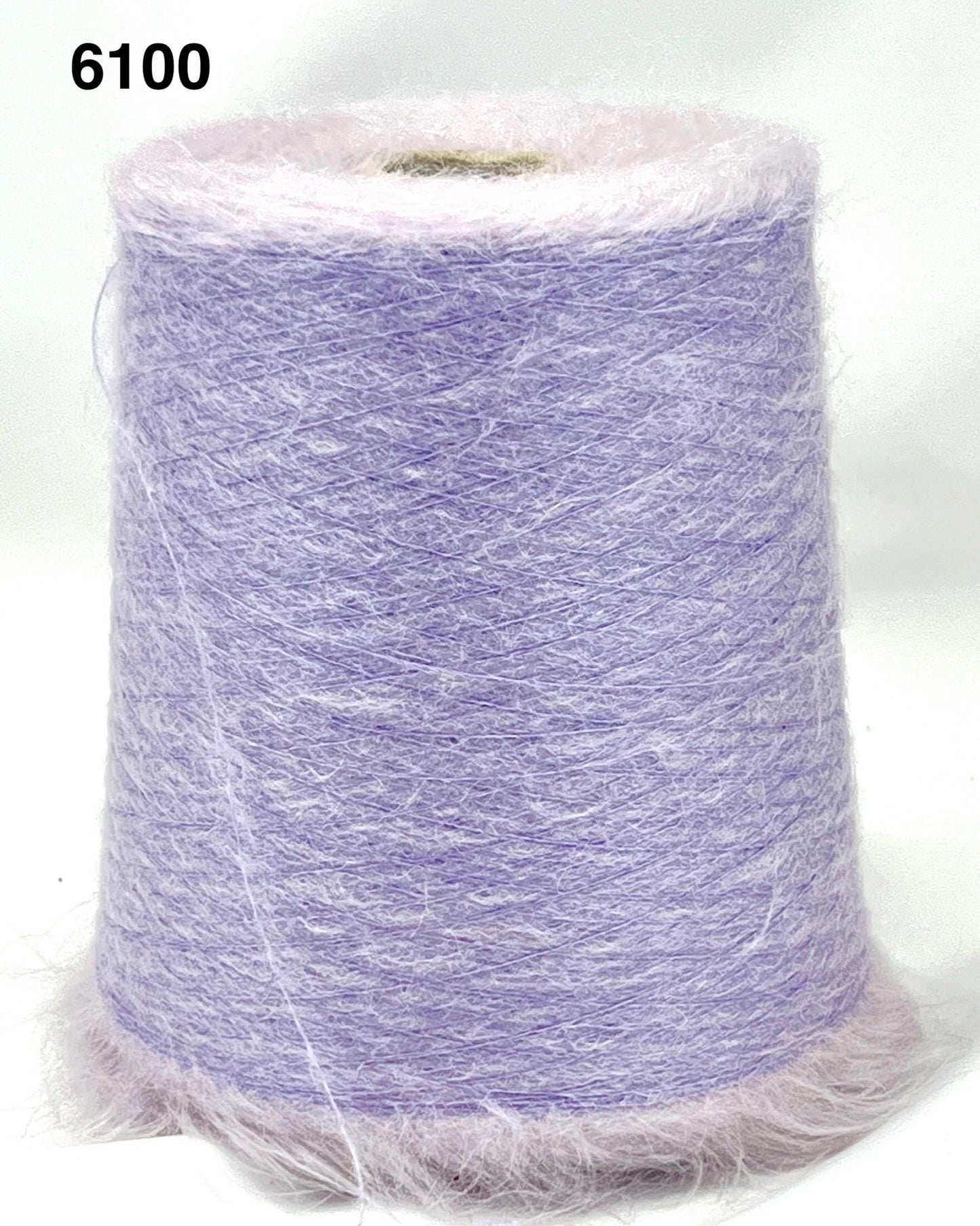 Spool of purple yarn on a white background