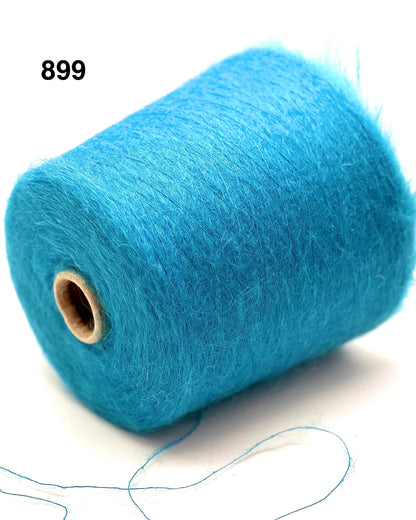 Blue spool of yarn on a white background
