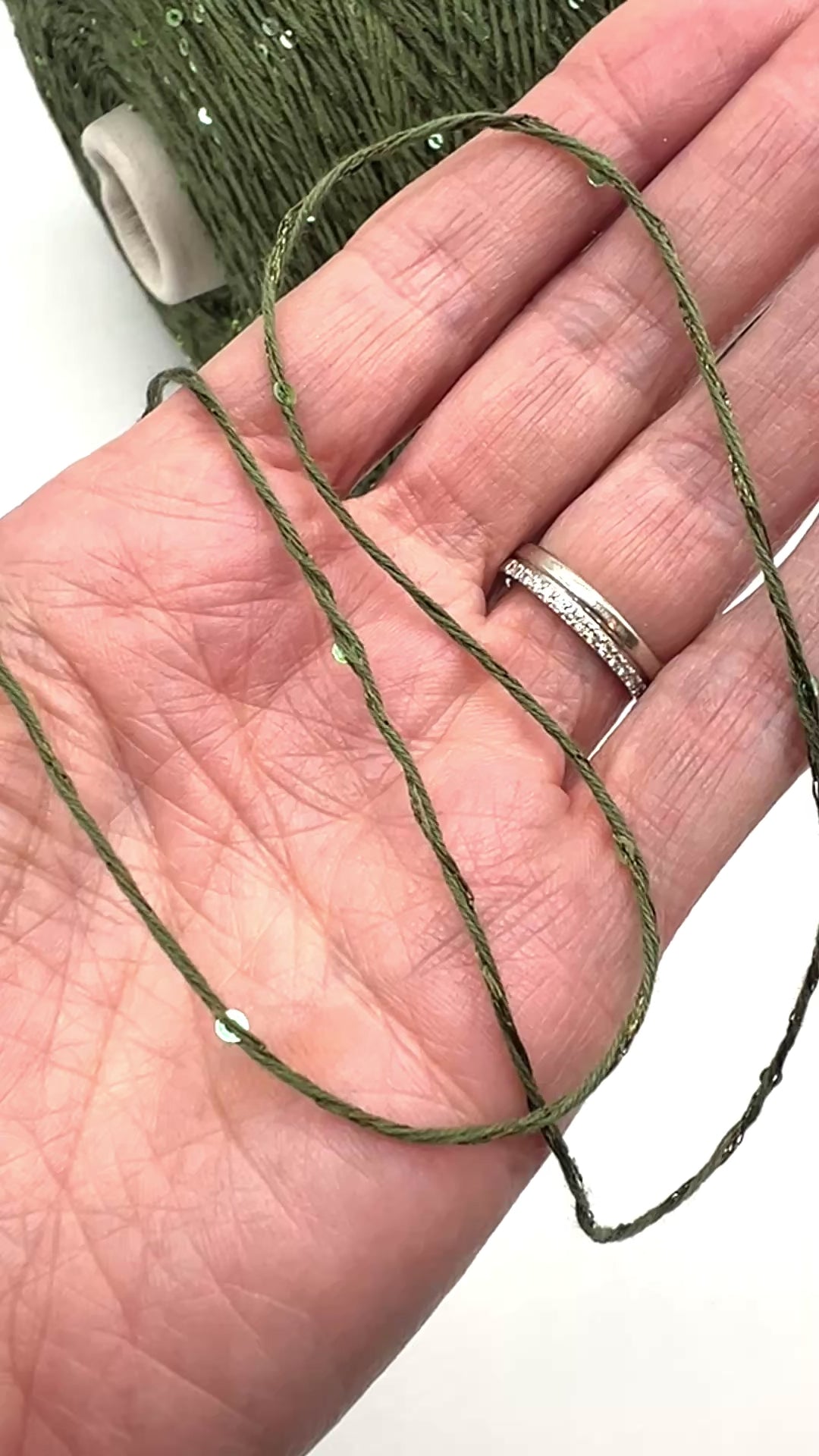 Professional grade RiGo STELLATO sport weight yarn from iDOKNiT, featuring a sophisticated 60% Italian cotton base with 2mm integrated paillettes. This authentic Italian-made yarn is curated by iDOKNiT to provide a refined shimmer and luxury finish for elegant, high-performance knitting projects.