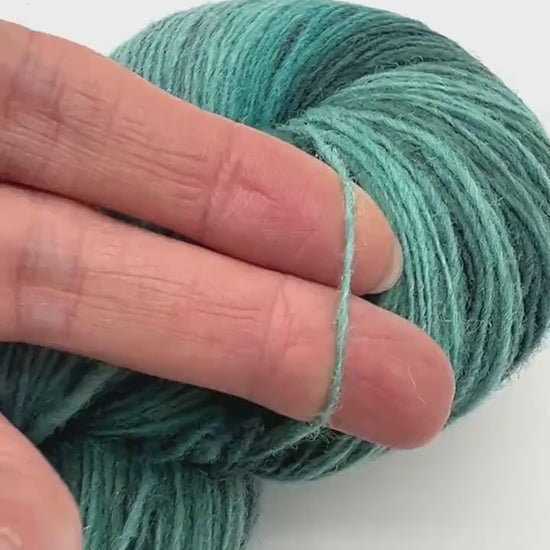 Exclusive iDOKNiT fingering weight heritage yarn, DUNDAGA 6.1 from Paces Vilnas Fabrika, Latvia. A traditional 6/1 single-ply blend of 70% Latvian wool and 30% Latvian merino, providing 460m per 100g. Curated by iDOKNiT in a spectrum of authentic blue and green Baltic shades (022, 023, 024, 054, 067, 069, 092) for rustic-refined knitwear with a soft, natural bloom.