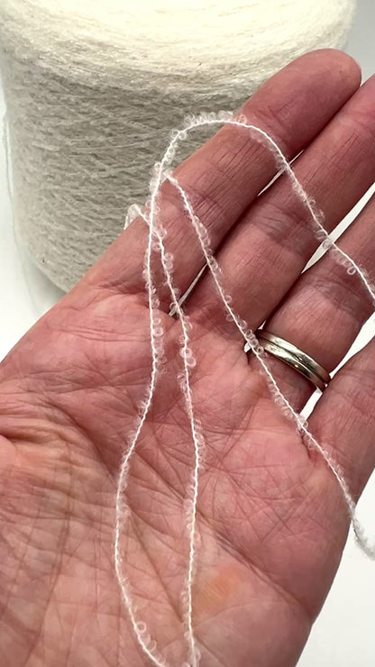 Elite iDOKNiT luxury micro-bouclé yarn, ESTRO by Zegna Baruffa Italy. 78% cashmere lace weight, Nm 9500. Authentic Italian-made soft airy loop yarn curated by iDOKNiT for professional knitting.