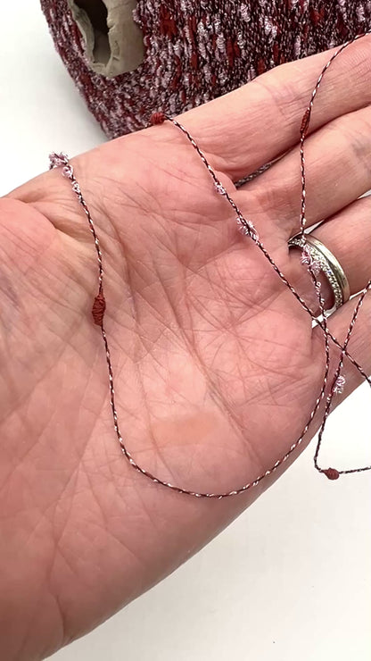 Exclusive iDOKNiT RiGo NODINO lace yarn featuring a radiant 67% viscose and 7% Lurex blend with a decorative Shishibriki texture for sophisticated Italian knitwear.