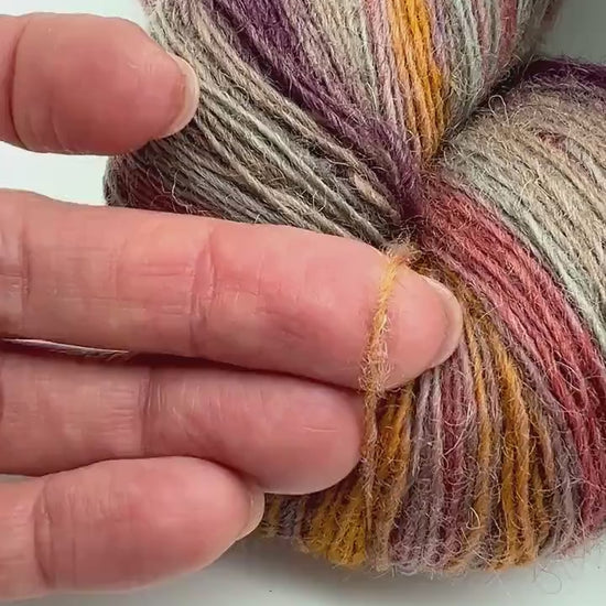 Exclusive iDOKNiT fingering weight wool, DUNDAGA 6.1 from Paces Vilnas Fabrika. 100% Merino wool from German sheep, traditionally processed in Latvia without chemicals to retain high lanolin content. Single-ply construction providing 420m per 100g. Curated by iDOKNiT for authentic, warm, and elastic knitwear with a natural "alive" feel.