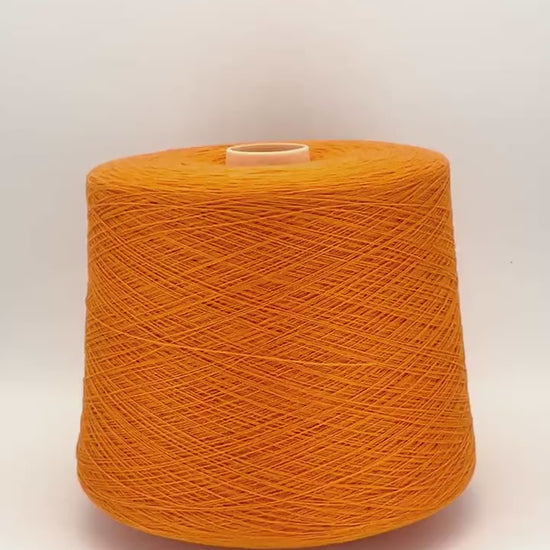 Todd & Duncan 100% Cashmere yarn (2/28 Nm) in a soft neutral palette. Shown as high-quality 2-ply lace weight thread on cones. Made in Scotland. Premium luxury yarn for retail at iDOKNiT.com.