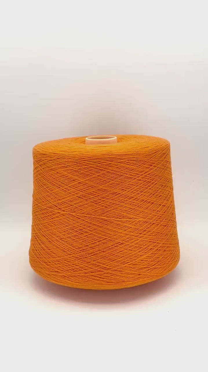 Todd & Duncan 100% Cashmere yarn (2/28 Nm) in a soft neutral palette. Shown as high-quality 2-ply lace weight thread on cones. Made in Scotland. Premium luxury yarn for retail at iDOKNiT.com.