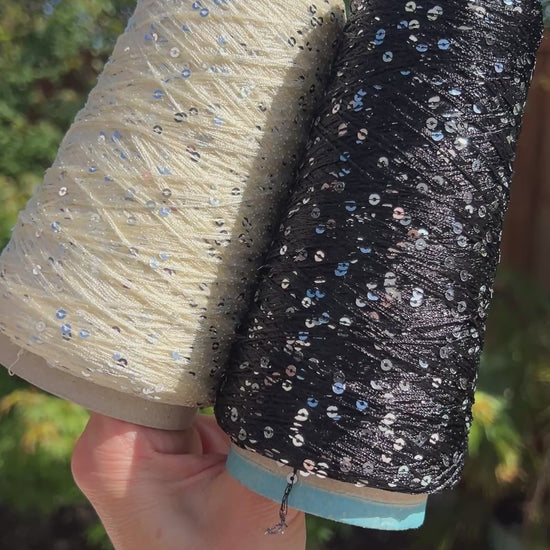Luxury Italian paillettes yarn ESTRELLA by ECAFIL
Soft chainette sequin yarn on original cone
Italian fashion paillettes yarn for luxury knitwear
Designer companion yarn with integrated paillettes
Luxury Italian cone yarn with silver and green paillettes