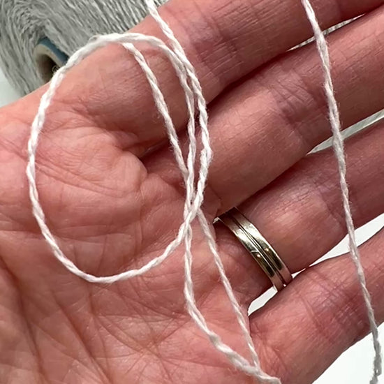 Elegant iDOKNiT SESIA SCOTLAND 100% Extrafine Merino Tweed lace yarn in Nm 2/14, showcasing a sophisticated rustic speckled texture and premium Italian wool quality.