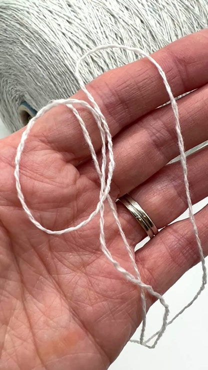 Elegant iDOKNiT SESIA SCOTLAND 100% Extrafine Merino Tweed lace yarn in Nm 2/14, showcasing a sophisticated rustic speckled texture and premium Italian wool quality.