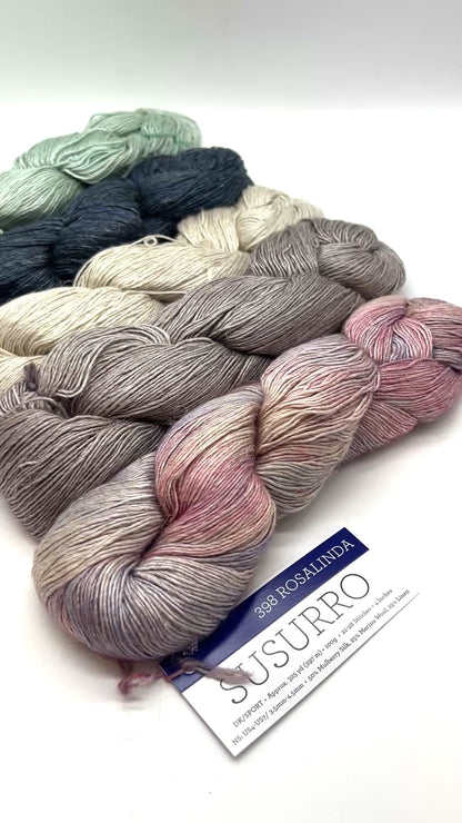 Premium iDOKNiT DK Sport weight yarn, SUSURRO by Malabrigo Peru. Luxury blend of 50% mulberry silk, 25% merino wool, and 25% linen, 297m/100g. Hand-dyed authentic Peruvian yarn curated by iDOKNiT for lightweight garments with elegant drape and sophisticated linen texture.