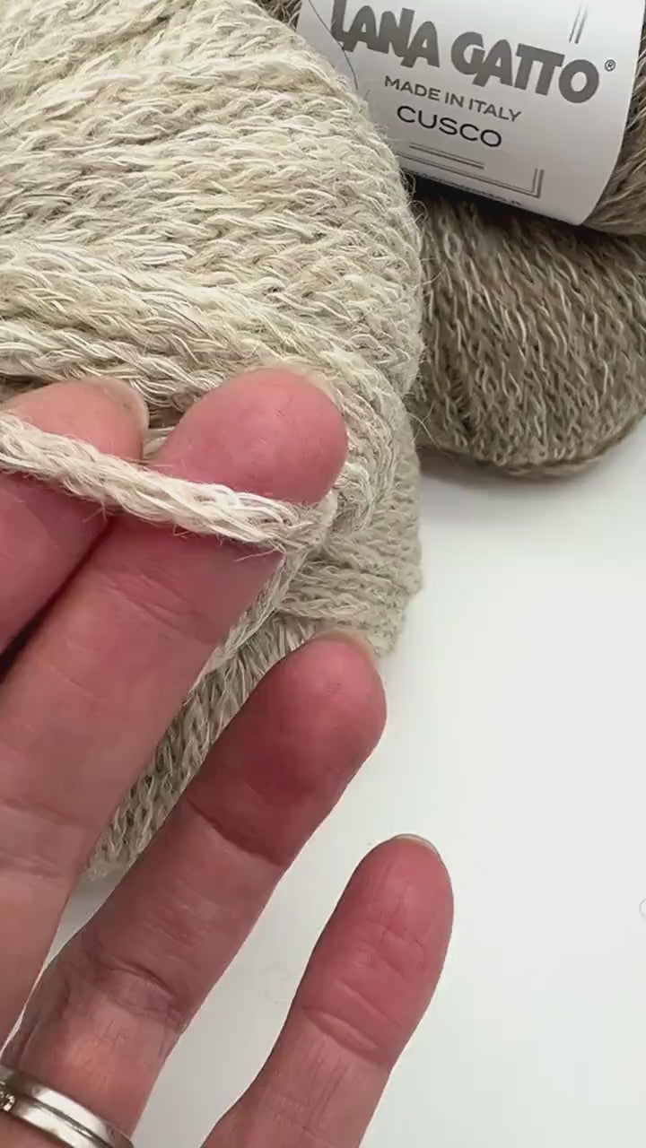 lana gatto cusco chunky chain yarn alpaca wool cotton italy 150m
luxury italian chain yarn lana gatto cusco alpaca wool cotton blend
soft chunky cable yarn for sweaters scarves hats lana gatto cusco
lana gatto cusco marled chain yarn natural beige gray brown tones
alpaca wool cotton chain construction yarn close-up texture italy
