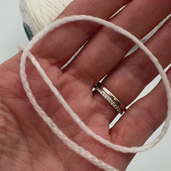 Rare CARIAGGI PIUMA 100% cashmere chainette yarn on original mill cone with original label and lofty cashmere texture.