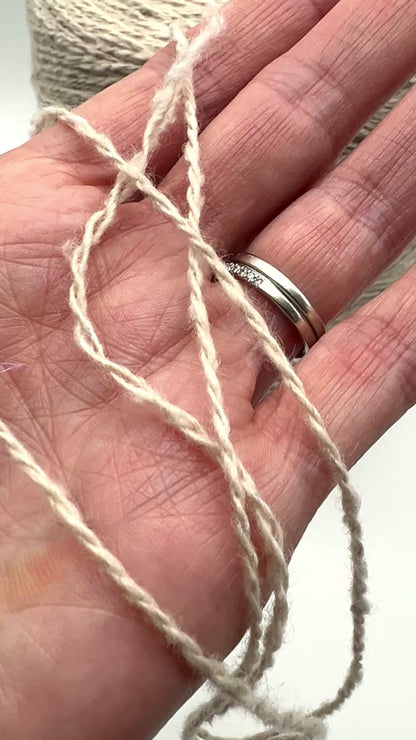 Gruppo Tessile Industriale WEB TWEED Italian cashmere yarn shown on professional cones. This 100% carded cashmere sport weight yarn features a subtle, modern tweed texture and soft loft. Premium luxury designer yarn available at iDOKNiT.com.