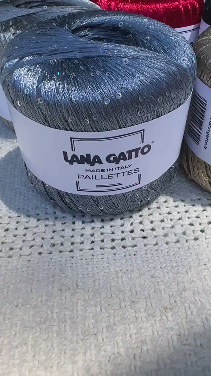 Lana Gatto Paillettes yarn in shimmering pastel tones, with delicate 2mm sequins, lightweight polyester yarn ideal for adding sparkle to knit or crochet projects. Made in Italy. 