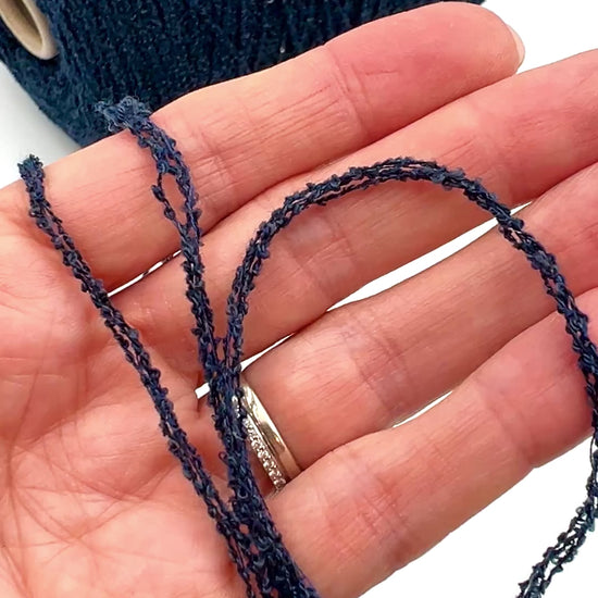 G&G Filati FRIZZ luxury 50% merino wool and 50% silk blend Italian sport weight fantasy boucle yarn in Midnight Blue with integrated 2mm transparent paillettes sequins for runway-ready fashion knitwear at iDOKNiT.