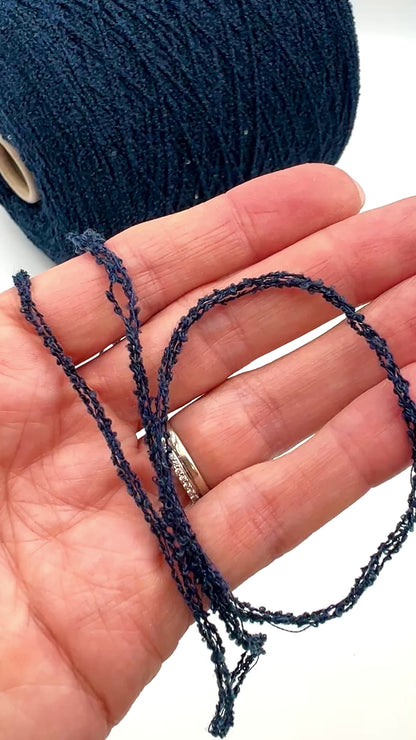 G&G Filati FRIZZ luxury 50% merino wool and 50% silk blend Italian sport weight fantasy boucle yarn in Midnight Blue with integrated 2mm transparent paillettes sequins for runway-ready fashion knitwear at iDOKNiT.