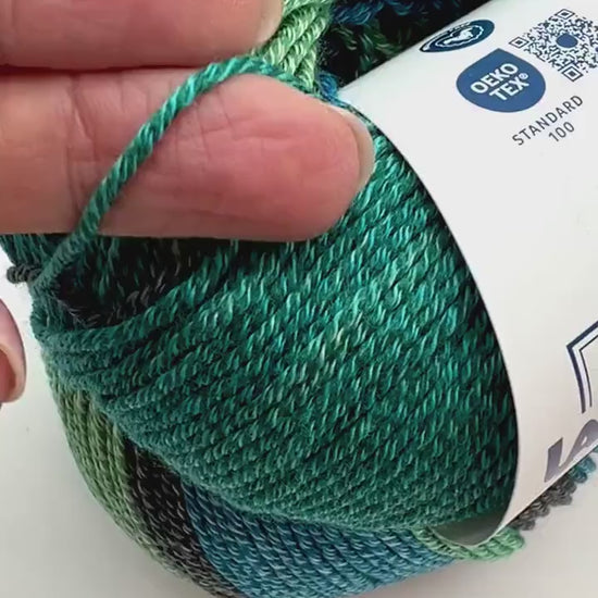 Exclusive iDOKNiT sport weight yarn, Gradient MERINOCOT by Lana Gatto Italy. A premium Italian-made blend of 53% merino wool and 47% cotton featuring a smooth gradient color transition. Providing 125m per 50g ball, this luxury fiber is curated by iDOKNiT for breathable, soft, and artistic garments with natural depth across all seasons.