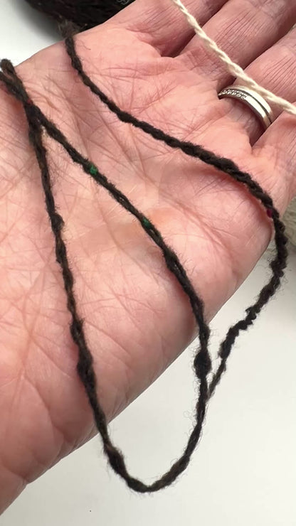 Gruppo Tessile Industriale WEB TWEED Italian cashmere yarn shown on professional cones. This 100% carded cashmere sport weight yarn features a subtle, modern tweed texture and soft loft. Premium luxury designer yarn available at iDOKNiT.com.