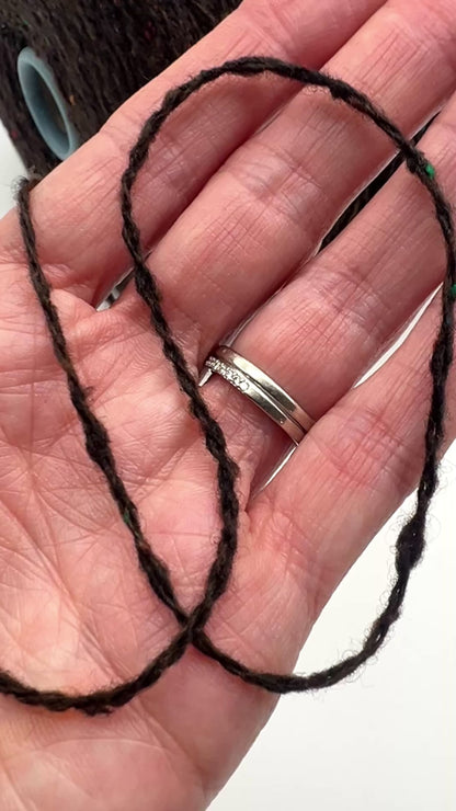 Gruppo Tessile Industriale WEB TWEED Italian cashmere yarn shown on professional cones. This 100% carded cashmere sport weight yarn features a subtle, modern tweed texture and soft loft. Premium luxury designer yarn available at iDOKNiT.com.