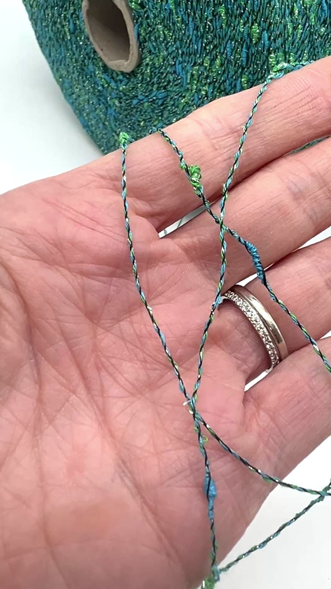 Exclusive iDOKNiT RiGo NODINO lace yarn featuring a radiant 67% viscose and 7% Lurex blend with a decorative Shishibriki texture for sophisticated Italian knitwear.