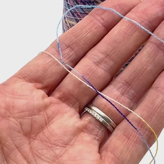 Rare MISSONI 100% Merino super fine yarn on cones. Features vibrant multicolor mixes like Violet Pink (806) and Green Orange (807). Premium Italian designer yarn available at iDOKNiT.com.