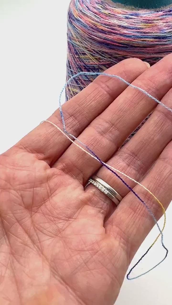 Rare MISSONI 100% Merino super fine yarn on cones. Features vibrant multicolor mixes like Violet Pink (806) and Green Orange (807). Premium Italian designer yarn available at iDOKNiT.com.