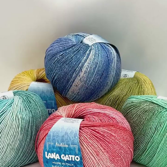 Luxury Italian designer yarn collection for iDOKNiT, featuring premium natural fibers on cones for professional hand-knit and machine-knitting projects.