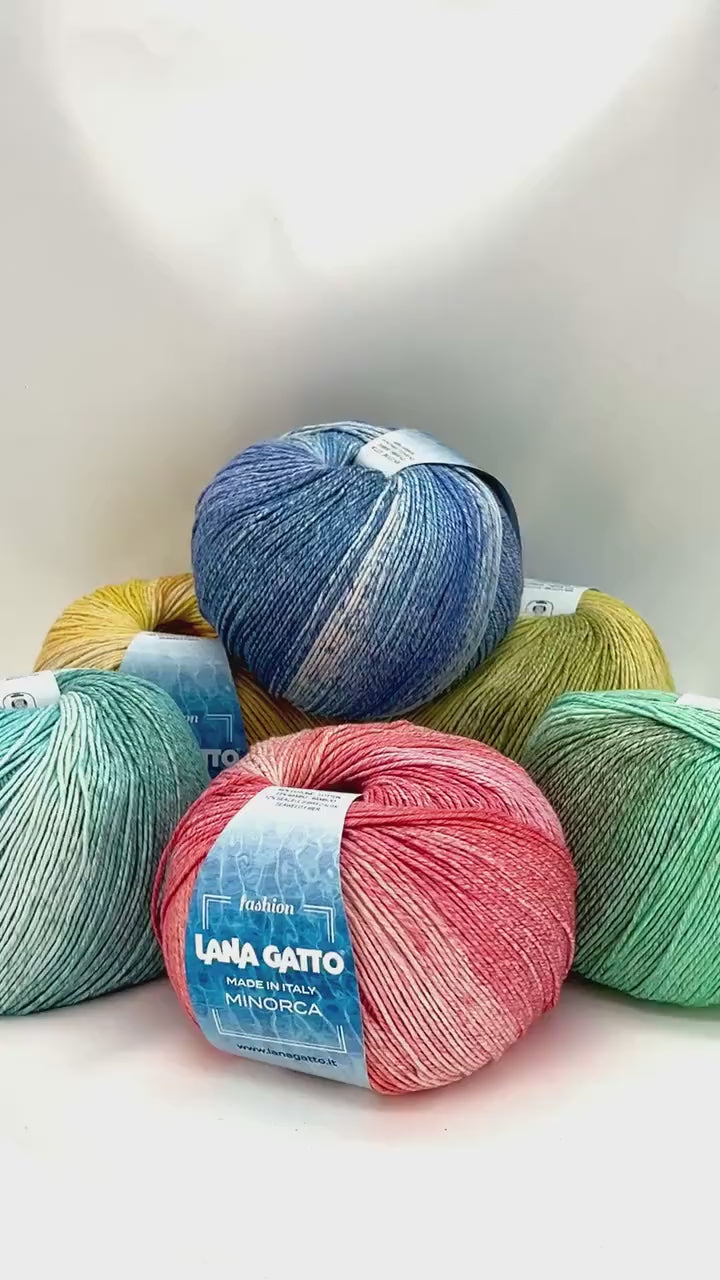 Luxury Italian designer yarn collection for iDOKNiT, featuring premium natural fibers on cones for professional hand-knit and machine-knitting projects.