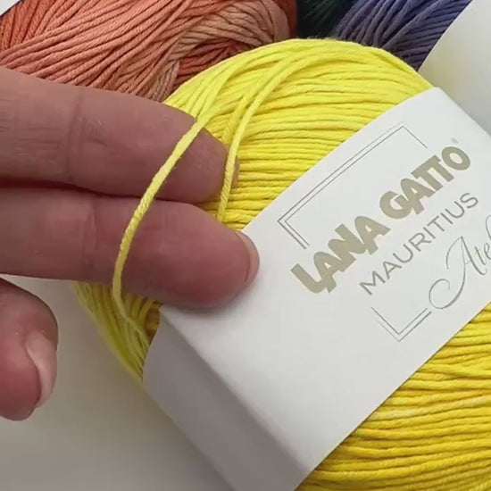 Lana Gatto MAURITIUS organic cotton yarn Italian fingering yarn
Luxury organic cotton yarn for summer garments and baby knits
Close up of MAURITIUS yarn showing smooth cotton texture
Italian organic cotton yarn for lightweight shawls and sweaters
Soft breathable fingering cotton yarn for elegant knitwear