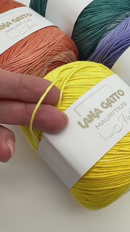 Lana Gatto MAURITIUS organic cotton yarn Italian fingering yarn
Luxury organic cotton yarn for summer garments and baby knits
Close up of MAURITIUS yarn showing smooth cotton texture
Italian organic cotton yarn for lightweight shawls and sweaters
Soft breathable fingering cotton yarn for elegant knitwear