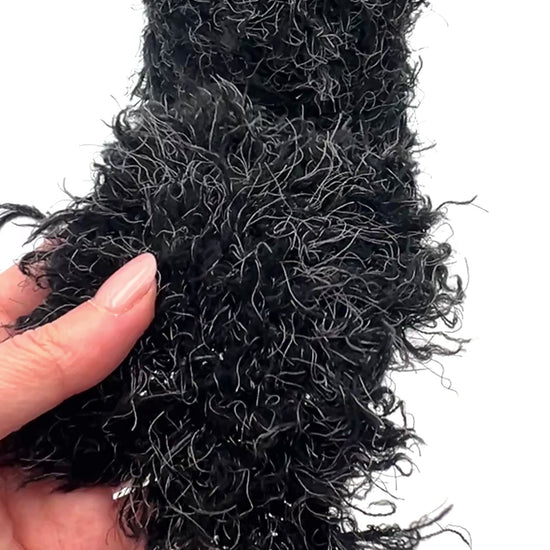 Fluffy fur merino silk yarn WISH GLOW chunky Italian yarn
luxury black fur effect yarn cone with grey fibers
soft fluffy merino silk yarn for jackets sweaters and scarves
dramatic textured chunky yarn close up luxury Italian yarn
statement fluffy fur yarn for couture knitting projects